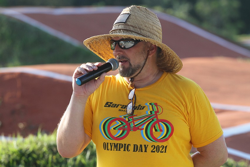 Sarasota BMX board president Jon Doty serves as announcer.