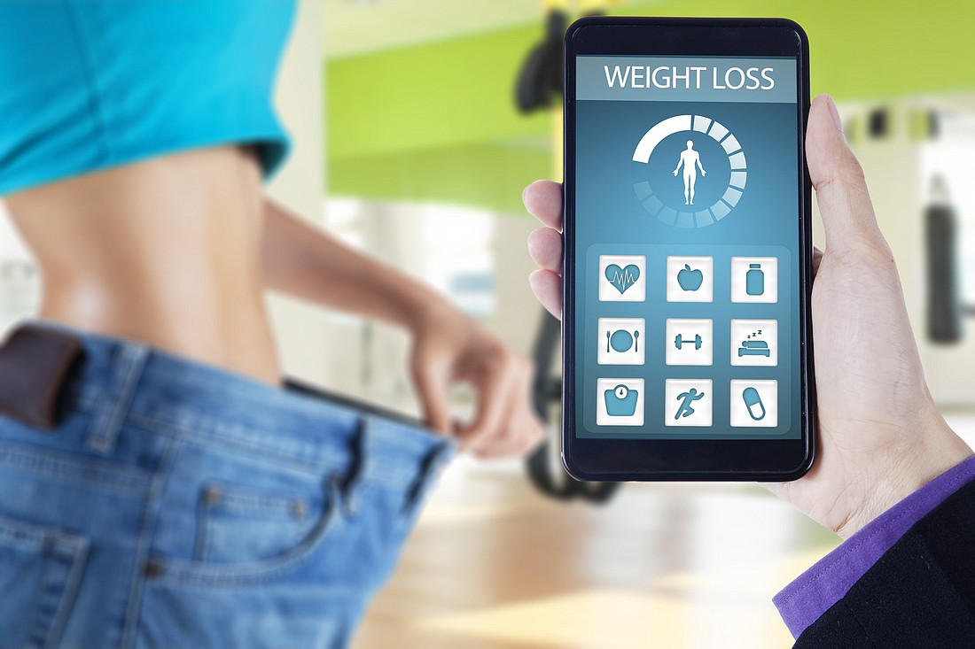 Digital health apps can help â€” if users can afford them. Photo via Shutterstock.