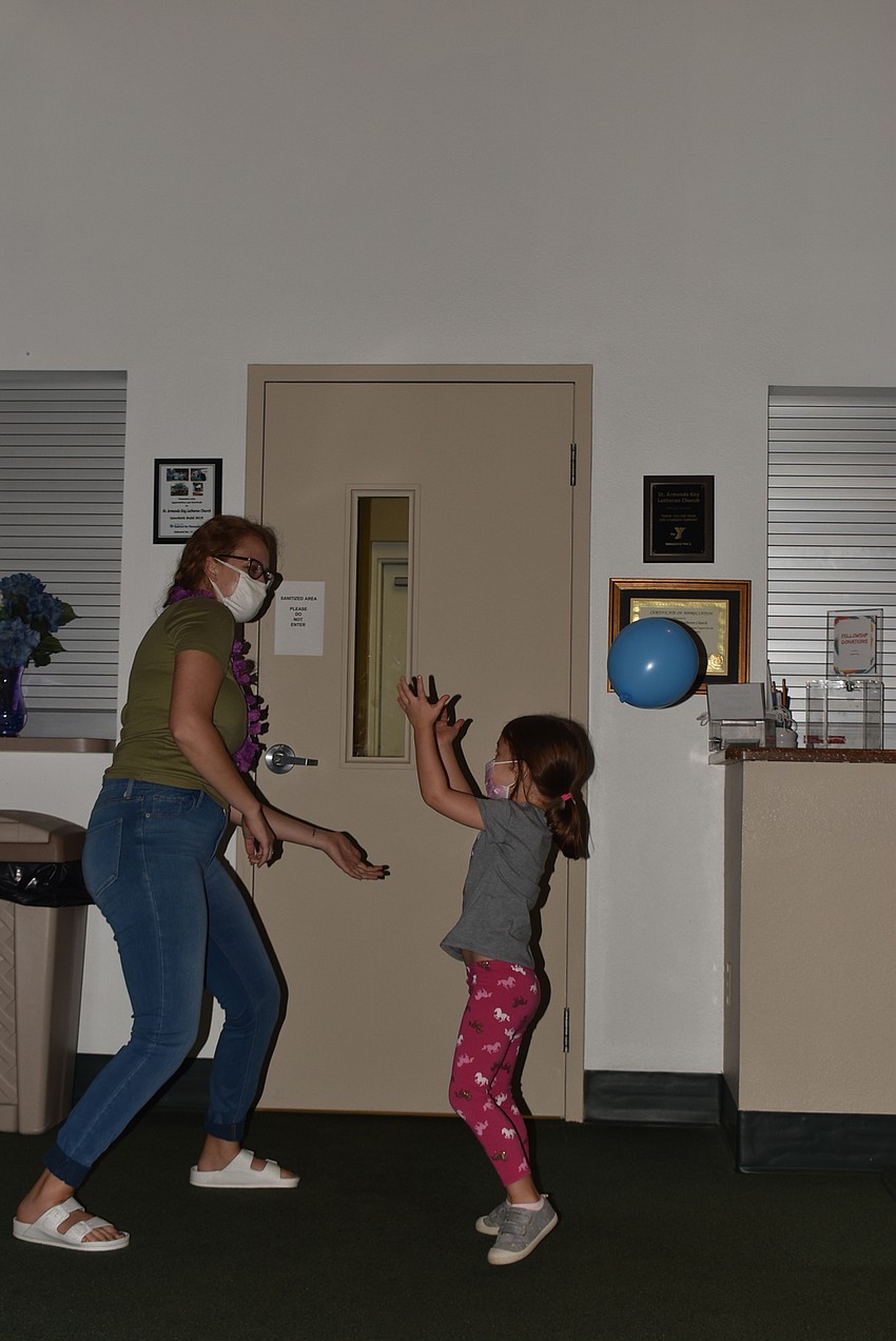 Nina Vannucci bops balloons with Sienna Campbell.