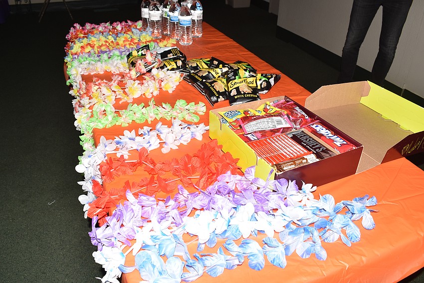 Nina Vannucci put out leis and snacks to get in the 