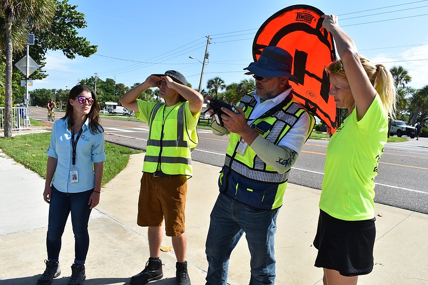 Lea Harper, Alex Harkinson, Hjalmar Pachas and Melissa Matisko watch as the DJI Matrice 300 RTK was in the air.