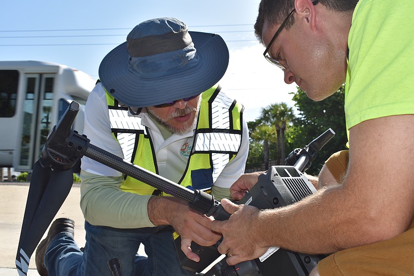 Hjalmar Pachas and Alex Harkinson  prepared the DJI Matrice 300 RTK before it took off.
