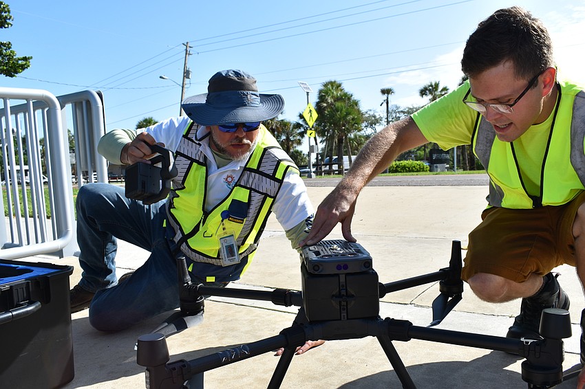 Hjalmar Pachas and Alex Harkinson  prepared the DJI Matrice 300 RTK before it took off.