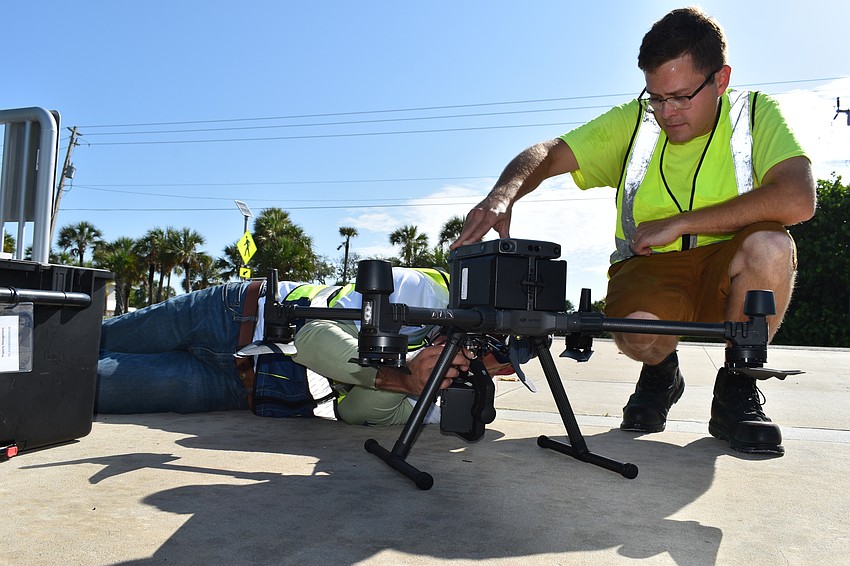 Hjalmar Pachas and Alex Harkinson  prepared the DJI Matrice 300 RTK before it took off.