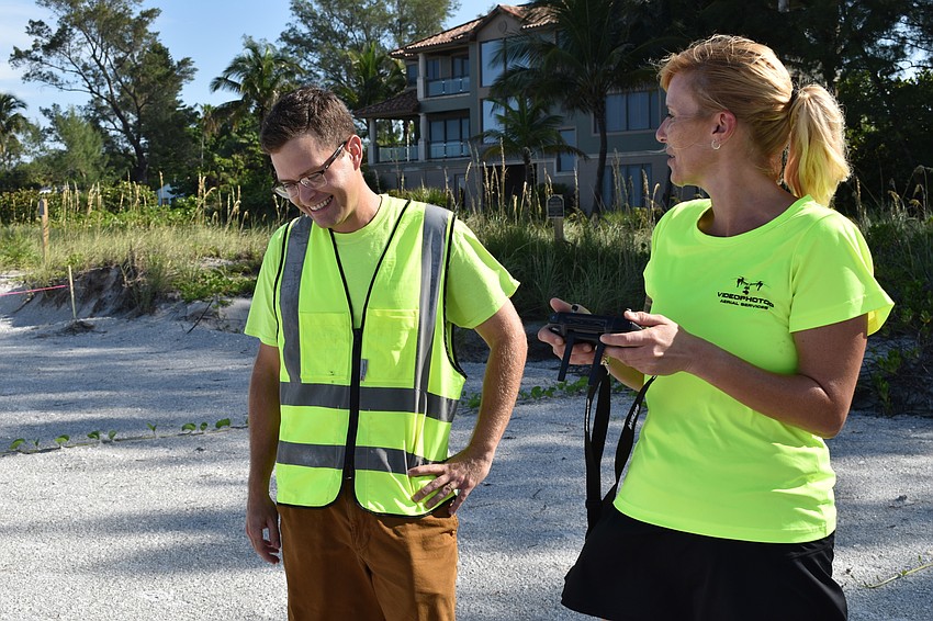 Alex Harkinson and Melissa Matisko chatted on the beach while flying the DJI Mavic 2 Pro drone.
