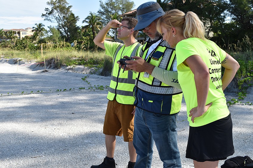 Hjalmar Pachas (middle) and Melissa Matisko (right) flew the DJI Mavic 2 Pro. Alex Harkinson  (left) looks on.