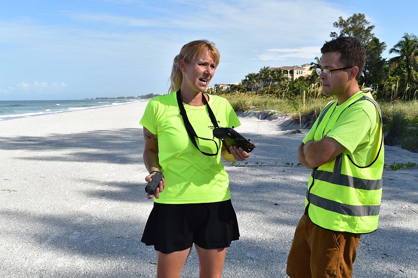 Melissa Matisko and Alex Harkinson chatted on the beach while flying the DJI Mavic 2 Pro drone.