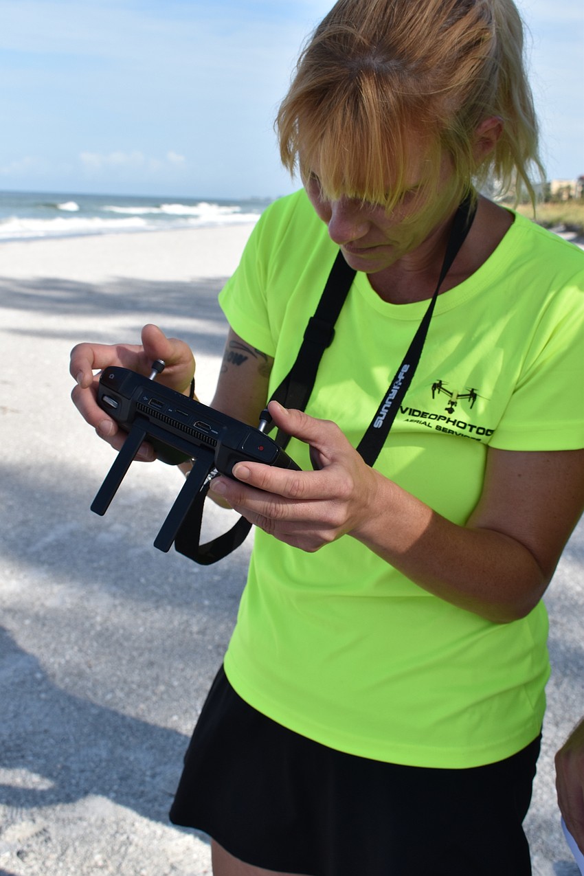 Melissa Matisko watches her screen while flying the DJI Mavic 2 Pro.
