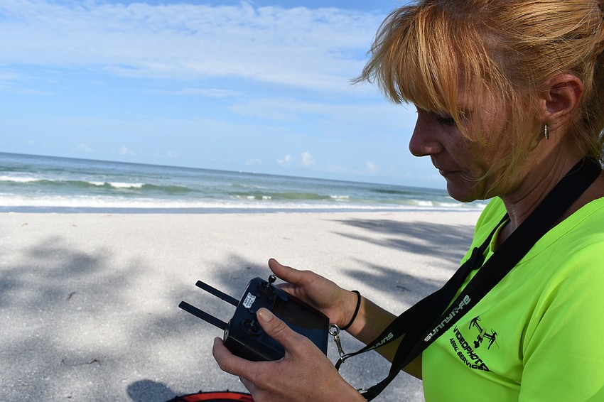 Melissa Matisko watches her screen while flying the DJI Mavic 2 Pro.