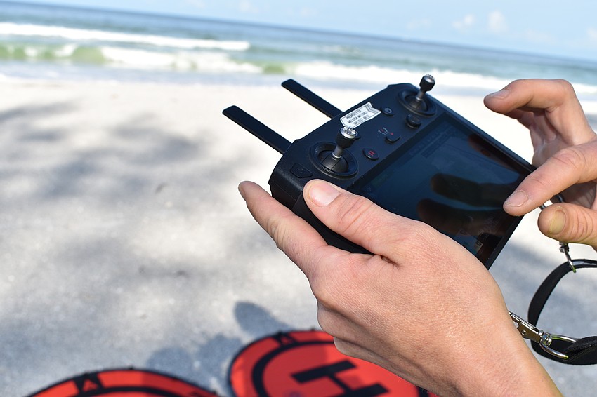 Melissa Matisko watches her screen while flying the DJI Mavic 2 Pro.