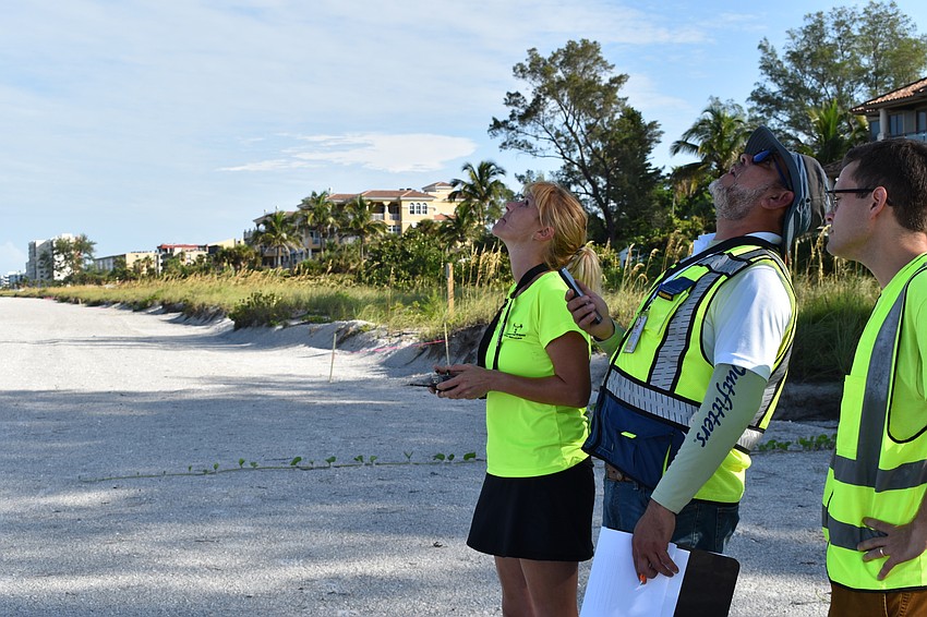 Melissa Matisko, Hjalmar Pachas and Alex Harkinson watched as the DJI Mavic 2 Pro flew in the air.