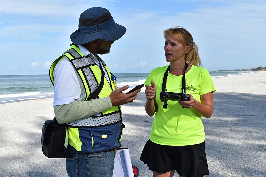 Hjalmar Pachas and Melissa Matisko chatted on the beach.