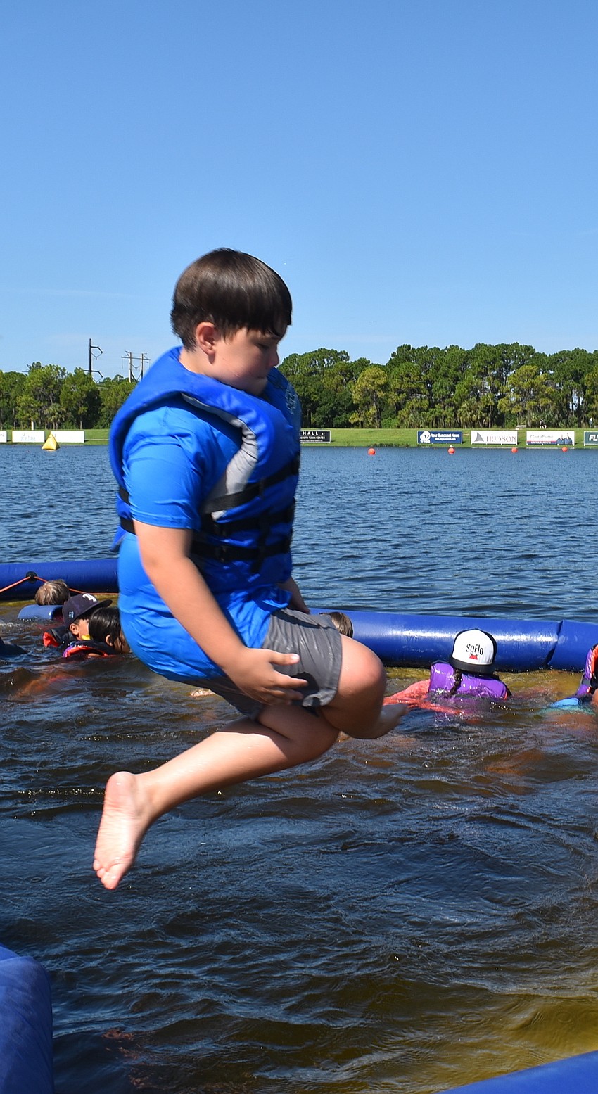 Venice's Jake Mains, 10, makes a big entrance by doing a cannonball into the swimming pool section of the lake. His favorite part of the week was kayaking.