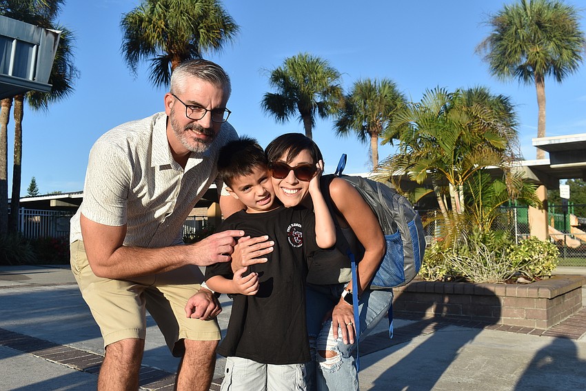 Tara Elementary School kindergartner Liam Shaffer is dropped off by parents Will and Marissa Shaffer. Liam Shaffer says he is excited to make new friends.