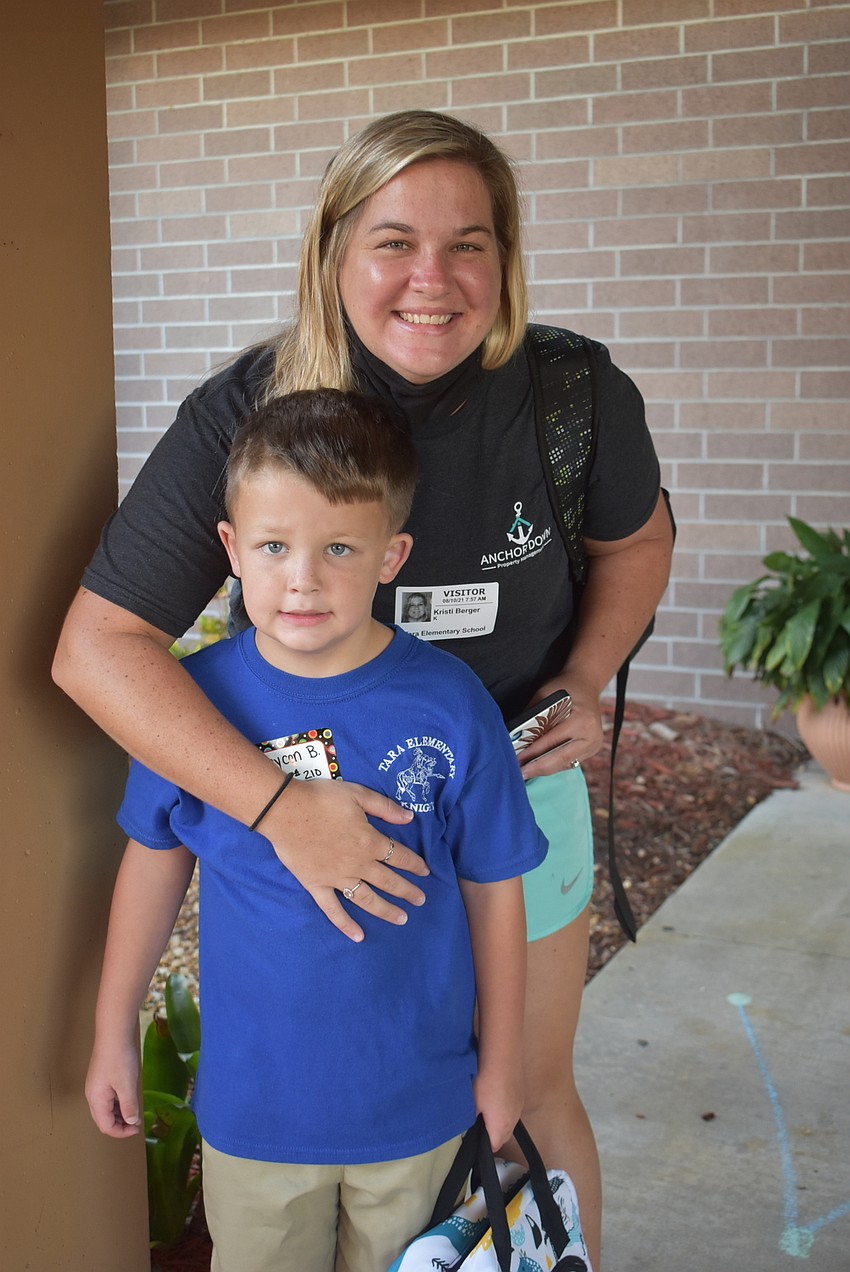 At Tara Elementary School, Kristi Berger drops off kindergartner Brycen Berger.