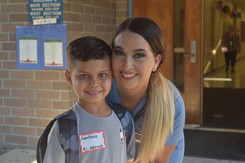 Santana Laucer gets ready to say goodbye to his mom, Brittney Lesperance, before his first day of kindergarten at Tara Elementary School. He is looking forward to coloring and making new friends.