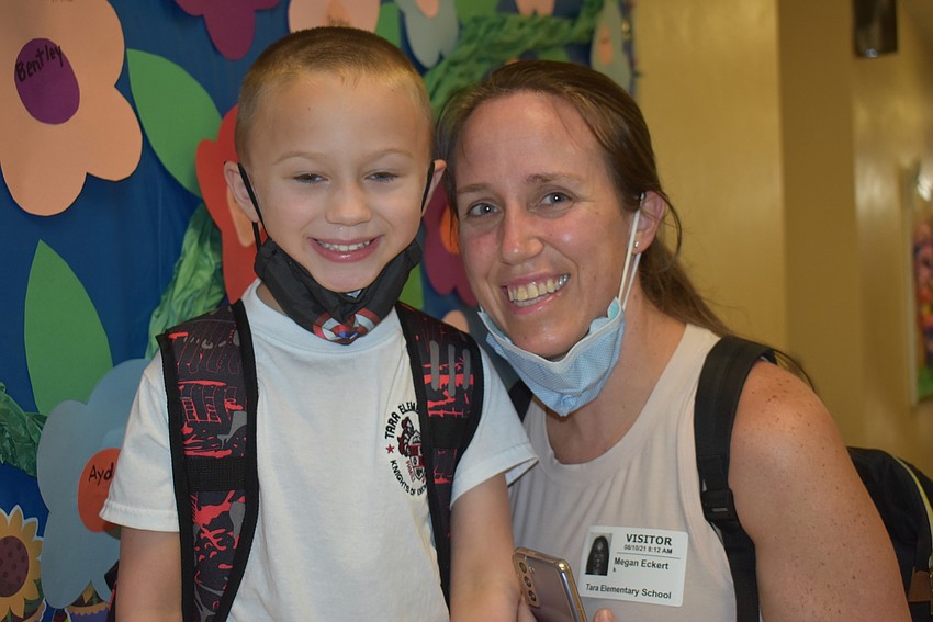 Kindergartner Cruz Eckert prepares to say goodbye to his mom, Megan Eckert, and make new friends at Tara Elementary School.