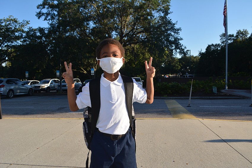 Arthur Jeffery, 6, poses outside Emma E. Booker Elementary School.