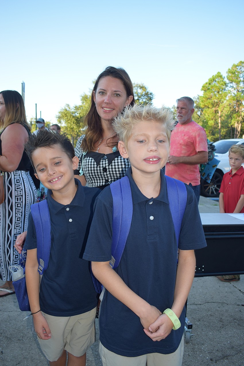 Million Clifft drops her sons Aiden Clifft, who is in second grade, and Elijah Clifft, who is in third grade, off at their first day of school at Braden River Elementary School. The family is new to the school.