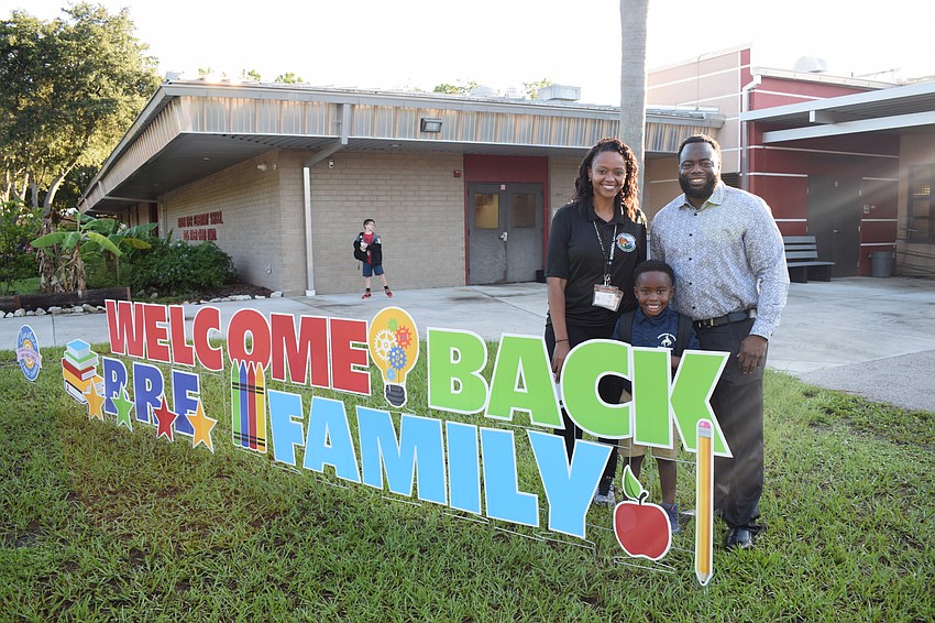 Kiera Gallon and Jamal Gallon commemorate their son, Braxton Gallon's, first day of kindergarten at Braden River Elementary School.