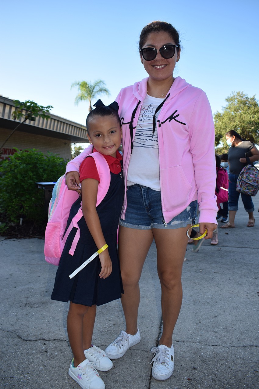 Constanza Alvarez, a first grader at Braden River Elementary School, prepares to say goodbye to her mother, Nayely Alvarez.