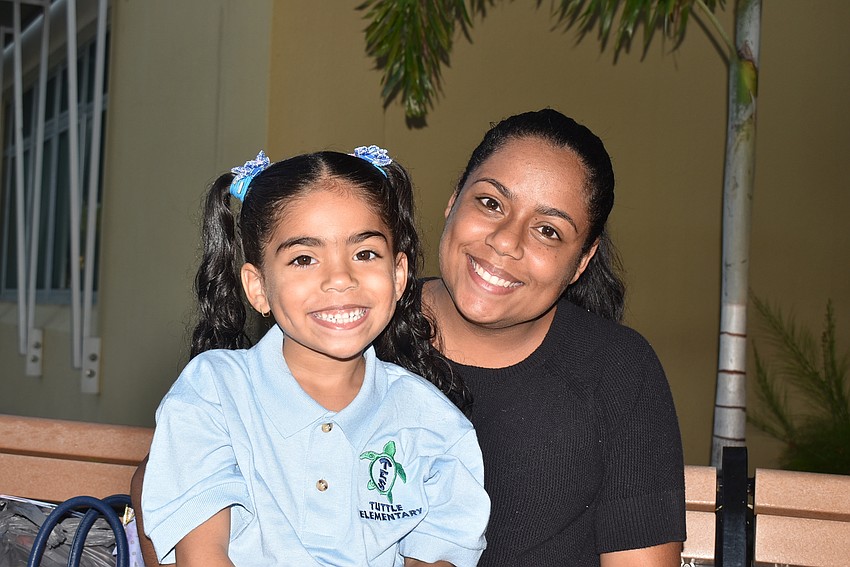 Alice and Sayanne Bianque wait for Tuttle Elementary to open. Alice is 10 and going into fifth grade.