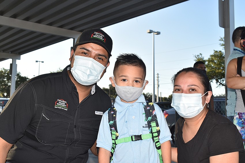 Manuel and Samuel Rocha with Ana Ponce. Samuel is starting his second year of pre-kindergarten, so Manuel and Ponce were accompanying him to class Tuttle Elementary School.