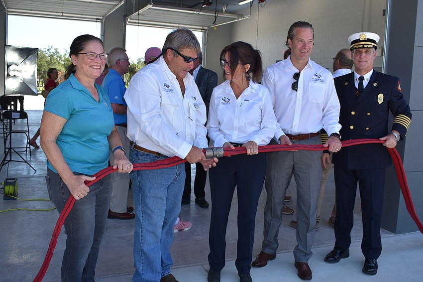 Wharton-Smith Inc. employees Jennifer Newman, Doug Whisler, Caryn Huff, Tom Iarossi stand for a photo with Fire Chief Paul Dezzi.