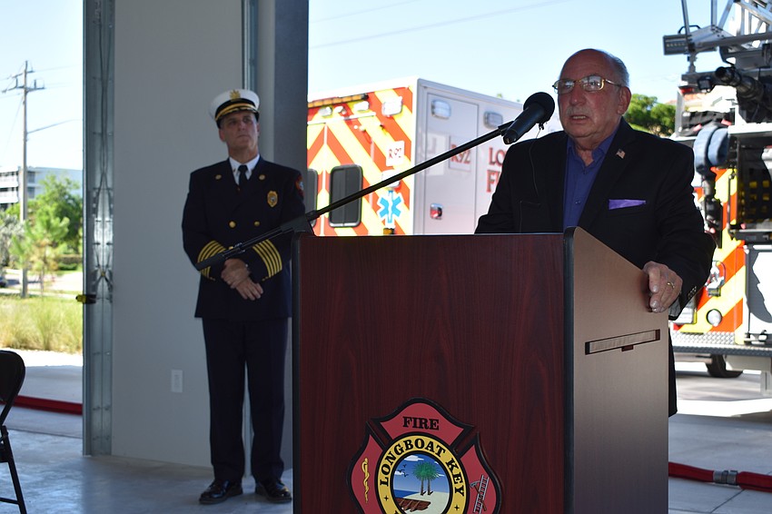 Norm Schimmel spoke during Wednesday morning's grand opening ceremony. Fire Chief Paul Dezzi looks on.