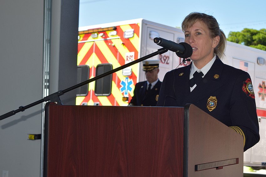 Longboat Key Fire Rescue Department Deputy Chief Sandi Drake spoke during Wednesday morning's grand opening ceremony. Fire Chief Paul Dezzi looks on.