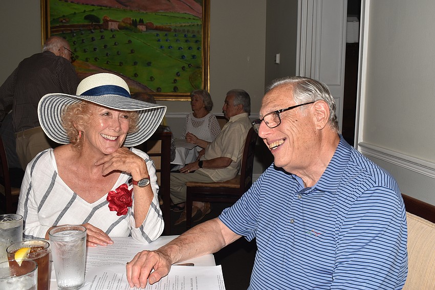 Suzanne Schuster and Allan Goldfarb catch up before dinner.