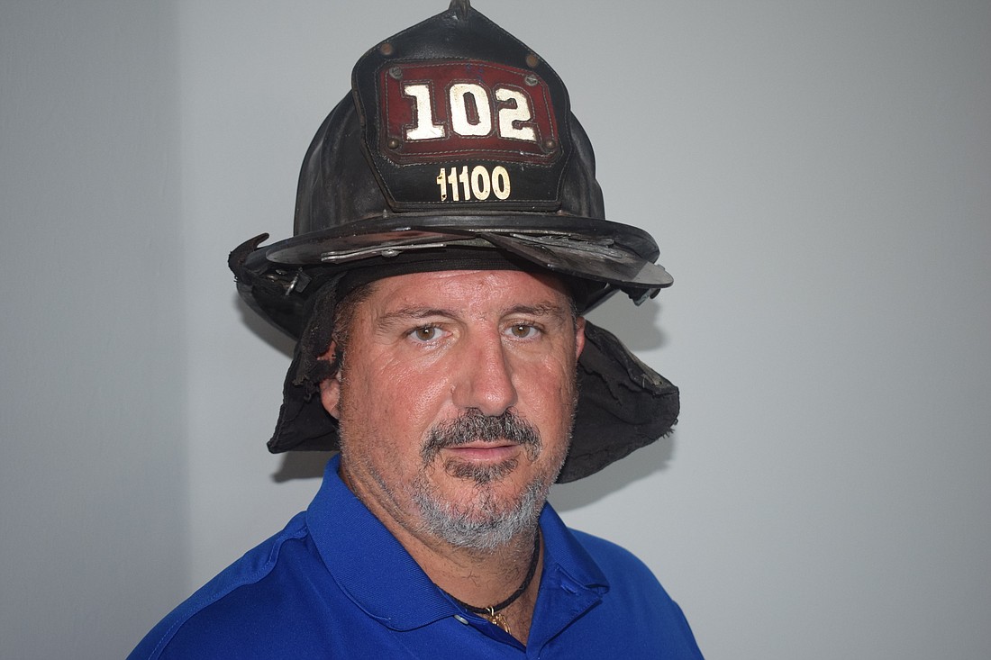 Lakewood Ranch&#39;s Steve Lubrino still has his Ladder 102 hat he wore as a New York City fireman who was fortunate to survive the collapse of the World Trade Center towers on Sept. 11, 2001.