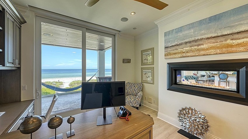 The home overlooks 151 feet of beachfront.