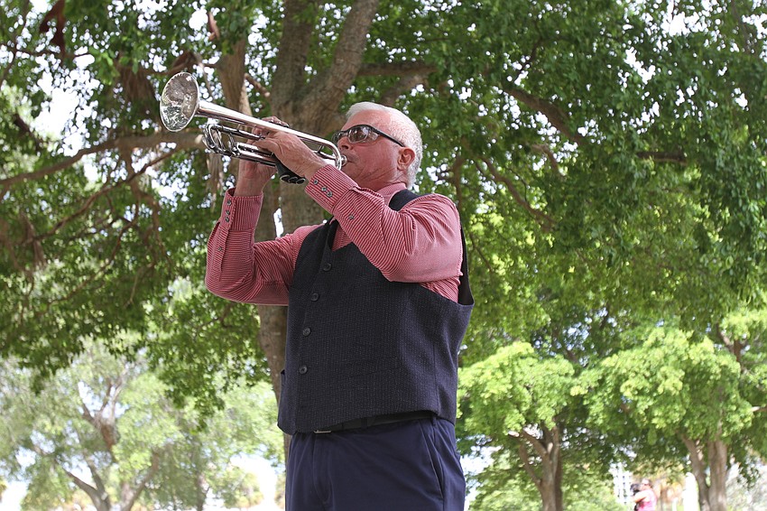 Danny Bilyeu plays Taps.