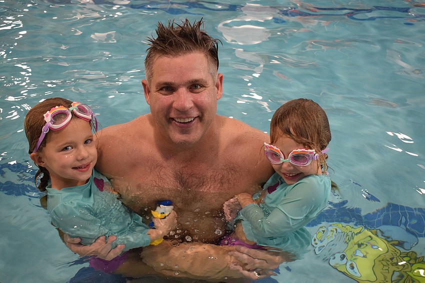 Sarasota's Maya Biter, who is 4, Ethan Biter and Ellie Biter, who is 4, have fun in the pool together.