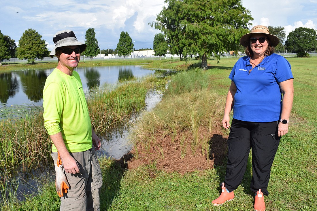 Cardno Senior Consultant Chris White and UF/IFAS Extension Agent Michelle Atkinson say additional plants greatly reduce nutrients that pour into stormwater ponds.