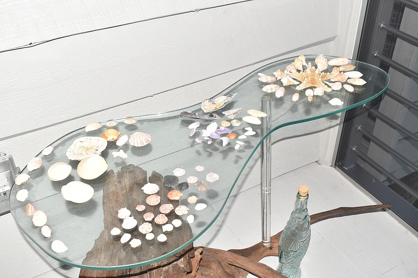 The porch outside the master bedroom has touches of the beach.