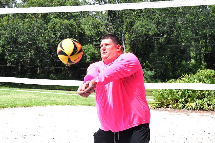 Chris McComas with Lakewood Ranch Community Activities shows Leslie and Ghyslaine McBean how to bump.