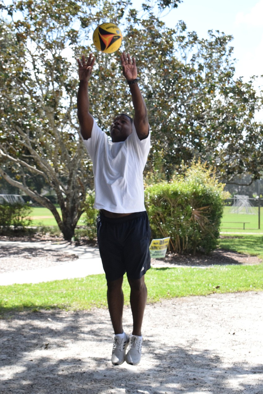 Lakewood National's Leslie McBean jumps to set the ball.
