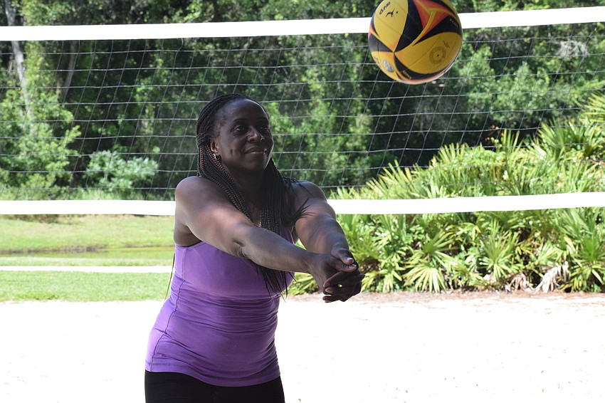 Lakewood National's Ghyslaine McBean passes the ball using a bump.