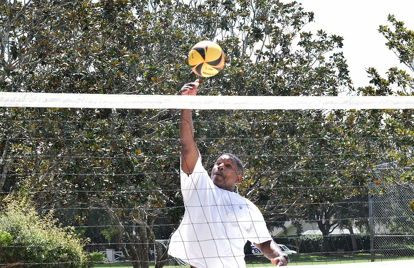 Lakewood National's Leslie McBean hits the ball over the net during a bump, set, hit drill.