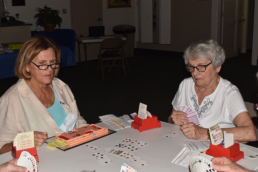 Kathy Rylander and Lynn Nieting try to get used to contract bridge.
