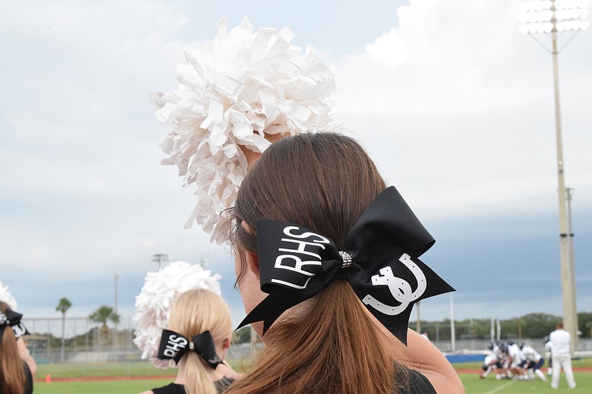 Lakewood Ranch High School cheerleaders are charged with keeping the spirit of the game up.