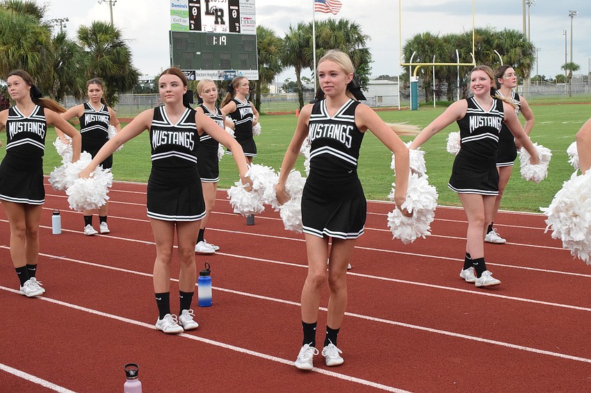 Cheerleaders shout their first chant of the night.