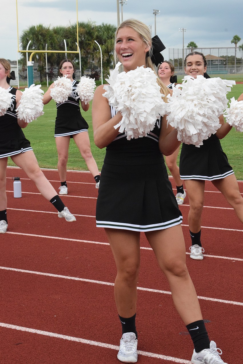 Taylor Folkers, who is the captain, is all smiles while cheering for the Lakewood Ranch High School football team. Her goal is to raise school spirit for the entire school this year.