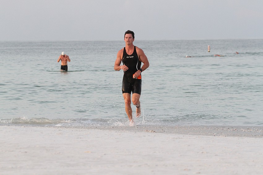 William Pearce finishes the swimming portion of the competition. He won the men's competition.