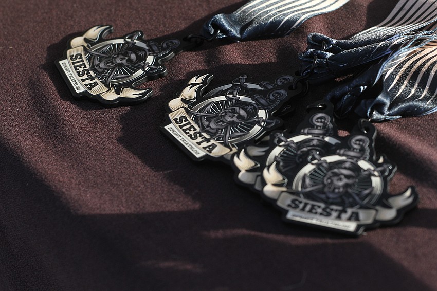 Competitors receive medals at the end of the run.