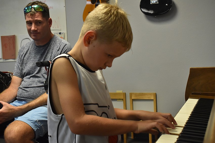 Triston Swederski plays piano.