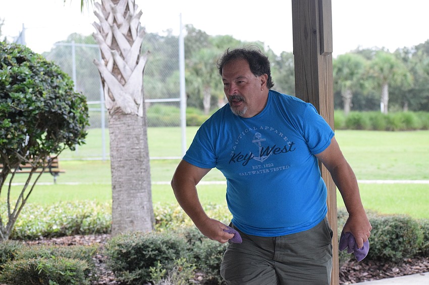 Lakewood Ranch's Marty Saia tosses a cornhole bag in hopes of earning a point for his team.