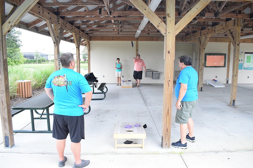 Lakewood Ranch's Mike Harmon and Mollie Saia compete against Chris McComas with Lakewood Ranch Community Activities and Lakewood Ranch's Marty Saia.